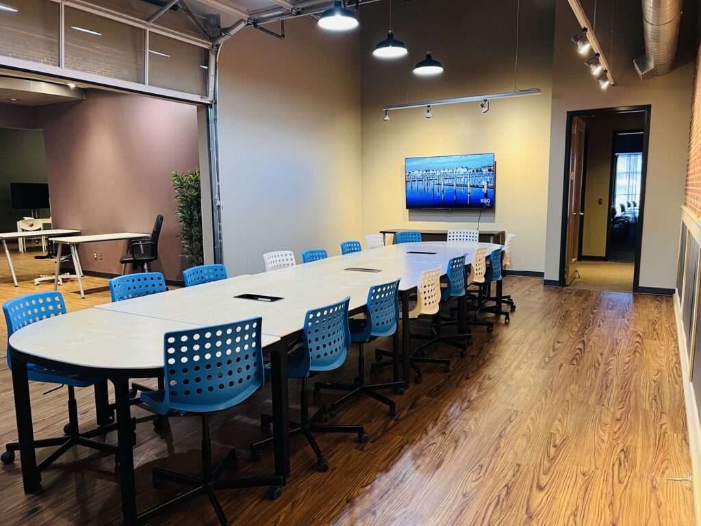 A meeting room with a small presentation monitor.