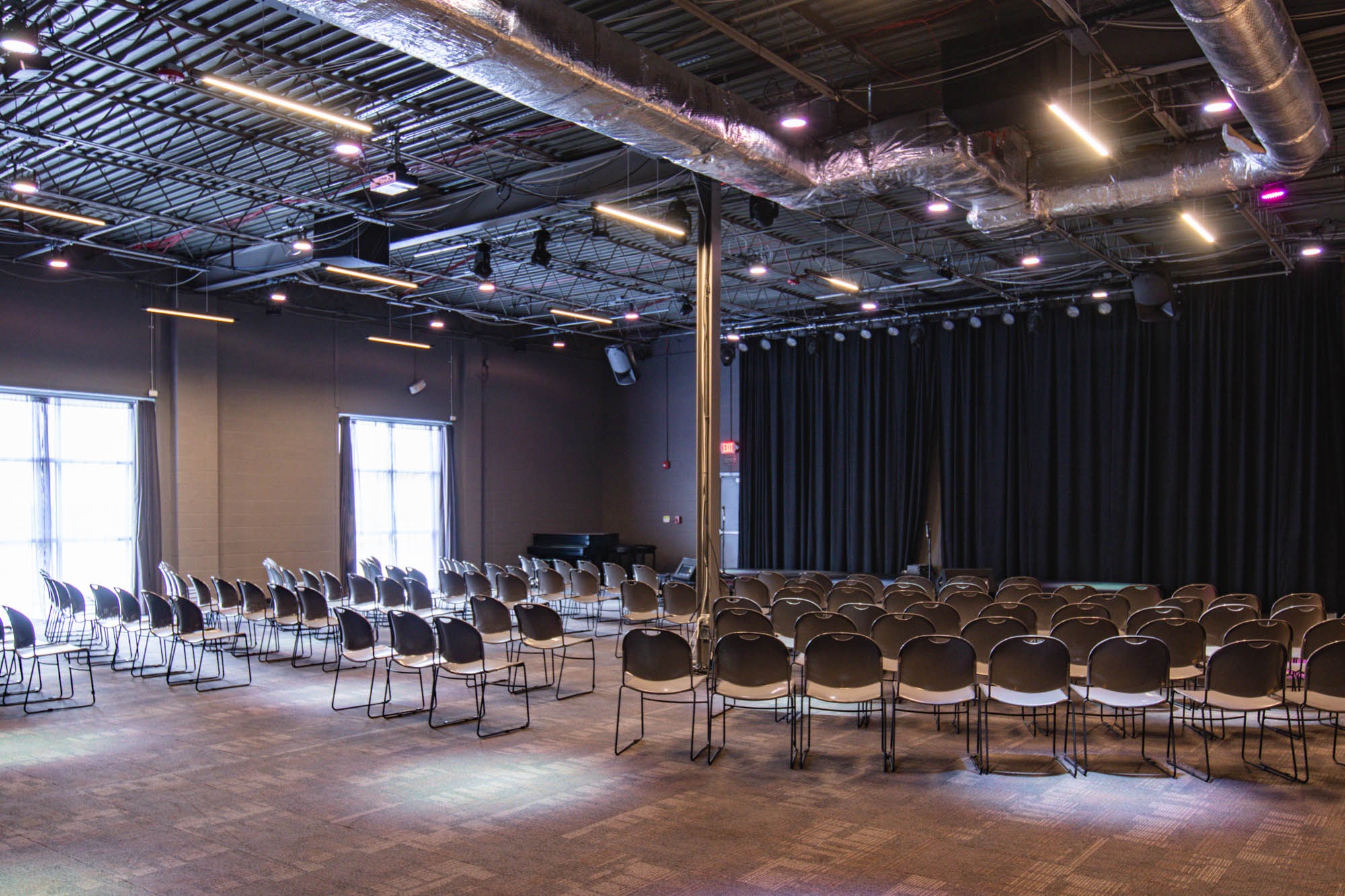 Chairs set up in front of a stage.
